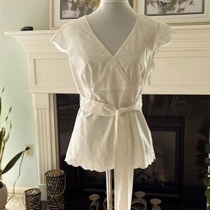 Antonio Melani cream colored blouse. Hip length, size small with belt.